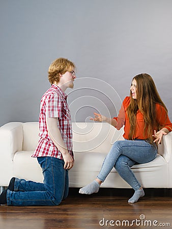 Man begging for forgiveness his woman Stock Photo