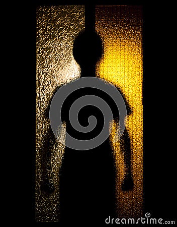 Man behind glass door Stock Photo