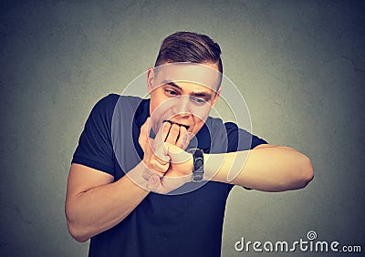 Man being late. Closeup portrait stressed guy checking time Stock Photo