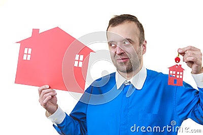 Real estate man with house model and keys Stock Photo