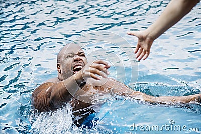 Man being rescued from the water Stock Photo