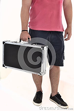 Man in bermuda carrying black briefcase on white background Stock Photo