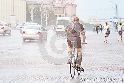 Man on the bicycle in the city street Editorial Stock Photo