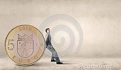 Man and big coin Stock Photo