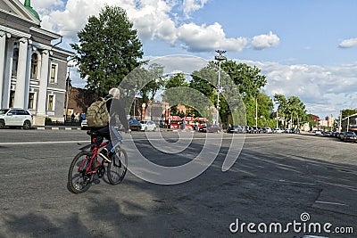 A man on a bike ride through the city Editorial Stock Photo