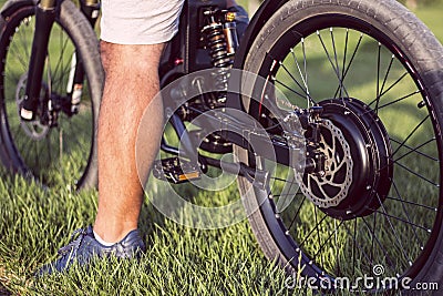 Man biker sitting on electric bike Stock Photo