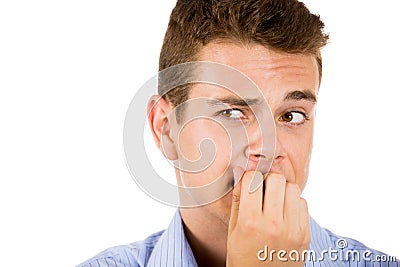 man biting his nails and looking to the side with a craving for something or anxious Stock Photo
