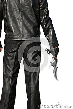 Man in black with an ancient knife Stock Photo