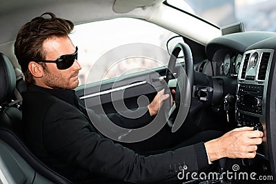 Man in black in luxury car Stock Photo