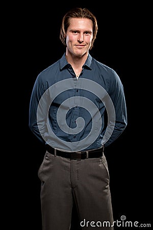 Man in Blue Shirt and Grey Slacks Stock Photo