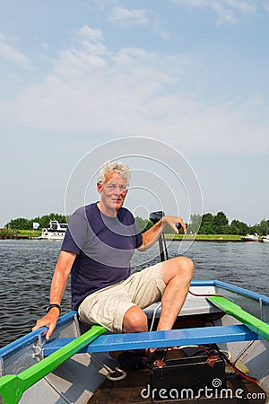 Man in boat Stock Photo