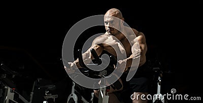 Man bodybuilder perform exercise Stock Photo