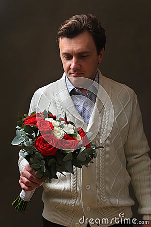 A man with a bouquet of roses Stock Photo