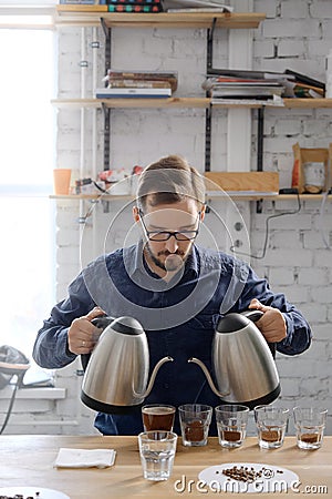 Man brewing fresh cupping coffee Stock Photo