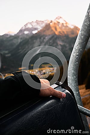 Man with briefcase on cable railway Stock Photo