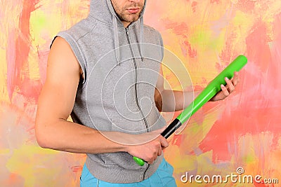 Man with bristle on colorful background. Guy in sleeveless hoodie Stock Photo