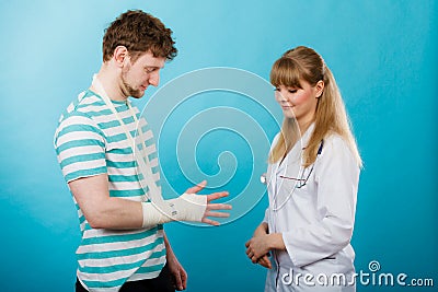 Man with broken hand visit doctor. Stock Photo