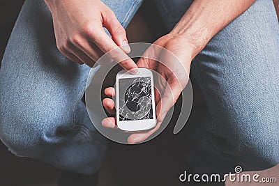 Man with broken smart phone Stock Photo