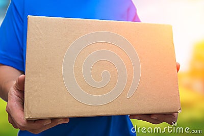 Man with brown box package delivery shipping Stock Photo