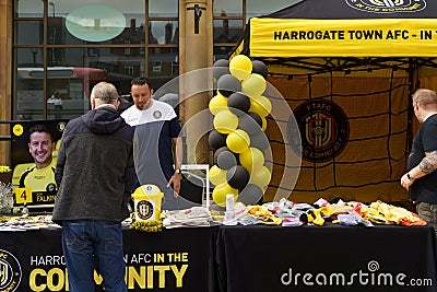 A Man Browsing at a Harrogate AFC Football Club Memorabilia Stand in the Town Centre. Editorial Stock Photo