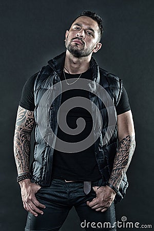 Man brutal unshaven hispanic appearance tattooed arms. Bearded man posing with tattoos. Brutal strict macho with tattoos Stock Photo