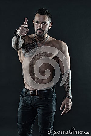 Man brutal unshaven hispanic appearance tattooed arms. Brutal strict macho with tattoos. Masculinity and brutality Stock Photo