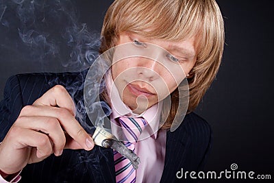 Man burns out dollars Stock Photo