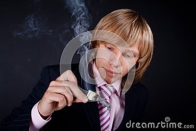 Man burns out dollars Stock Photo