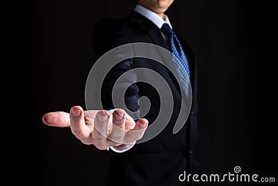 Man holding his hand out and showing something Stock Photo