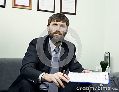 Man in a business suit holding a job interview. Ready for interview. Stock Photo