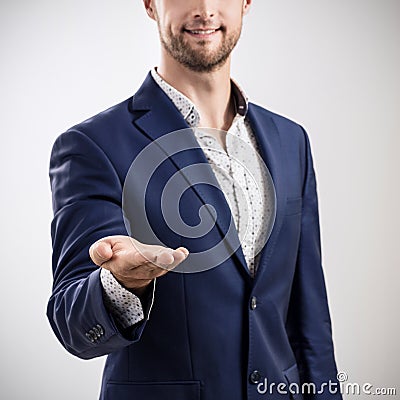 Man shows outstretched hand with open palm. Stock Photo
