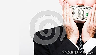 Man businessman in a suit with a closed one dollar bills mouth, silent for money. the concept of corruption and bribery Stock Photo