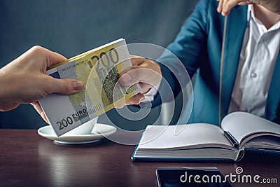 Man Businessman in suit takes the money hands. A bribe in the form of euro bills. Concept of corruption and bribery Stock Photo