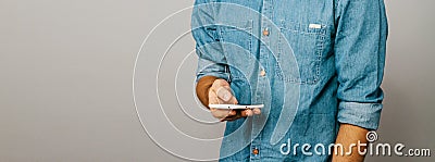 The man is busy on the phone. Slider web site. Denim blue shirt. Stock Photo