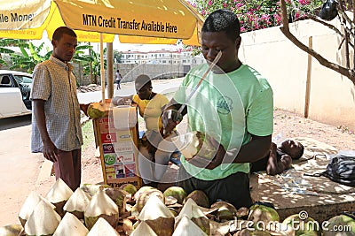 Man buys Fruits on a Accra street - Ghana Editorial Stock Photo