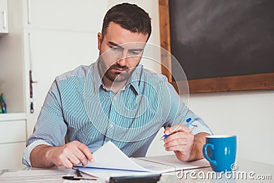 Man calculating bills and tax expense Stock Photo