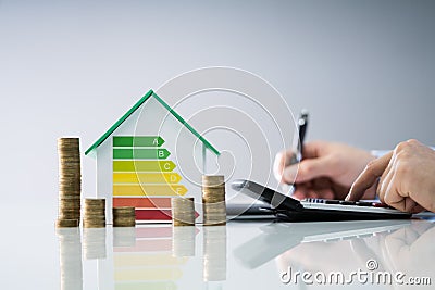 Man Calculating Energy Efficient House Stock Photo