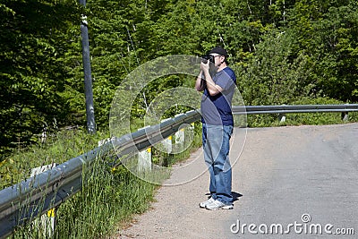 Photographer on an outdoor shoot Stock Photo
