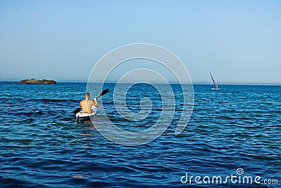 Man on a canoe in the sea, Kayaking, Canoeing Editorial Stock Photo