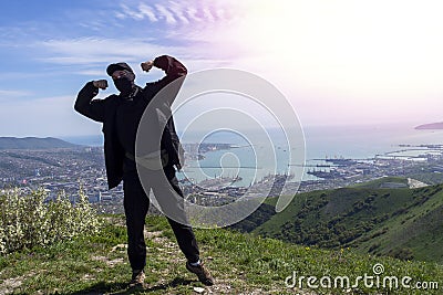 Man stands against the background of a port city Stock Photo