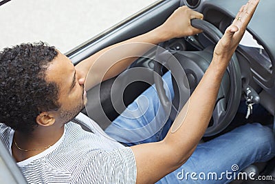 Man in car annoyed by traffic Stock Photo