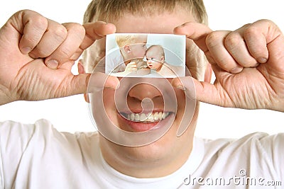 Man with card of kids on eyes, collage Stock Photo