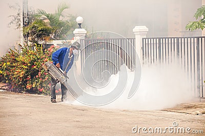 Man carries out fogging at village for anti-mosquito Editorial Stock Photo