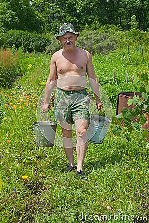 Man carrying water 2 Stock Photo