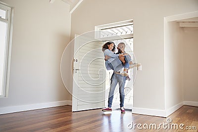 Man Carrying Woman Over Threshold Of Doorway In New Home Stock Photo