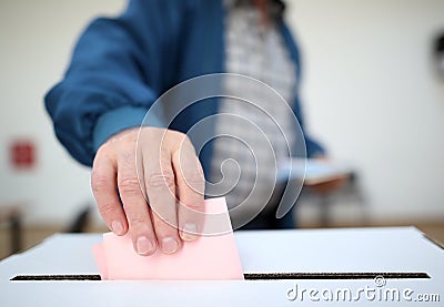 Man casts his ballot at elections Stock Photo