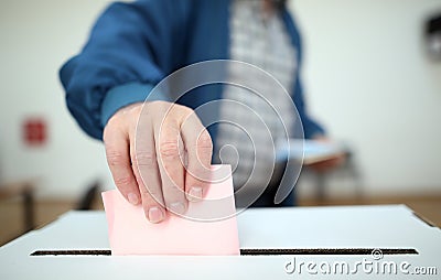 Man casts his ballot at elections Stock Photo