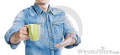 A man in casual style wear suggesting cup of coffee. Invite customer to taste. No face, closeup banner, white background, copy spa Stock Photo