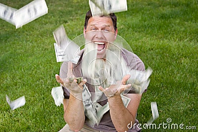 Man catching paper money Stock Photo