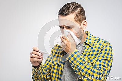 Man caught cold , flu, running nose. Healthcare and medical concept. Checking temperature Stock Photo